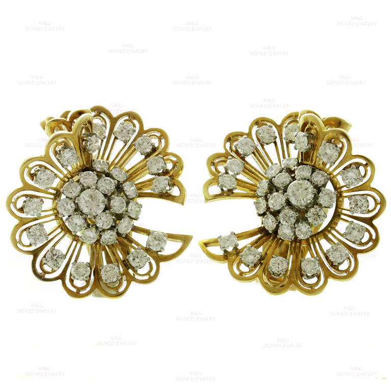 These retro Van Cleef & Arpels clip-on earrings are made in 18k yellow gold and prong-set in fine platinum with brilliant-cut round F-G VVS2-VS1 diamonds of an estimated 5 carats. Can be worn as double brooches by raising a tiny pin tucked away