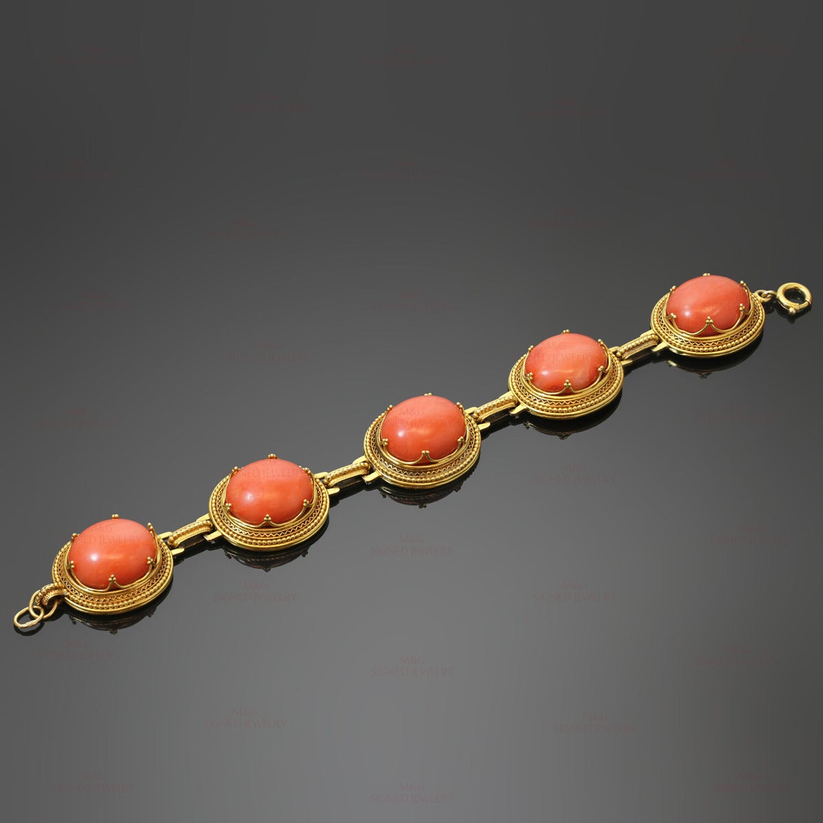 This rare Victorian link bracelet features a fantastic filigree design crafted in 14k yellow gold and set with oval natural red corals measuring between 9.7mm x 14.3mm x 16.6m to 8.5mm x 13.8mm x 16.2mm. Made in United States circa 1900s.