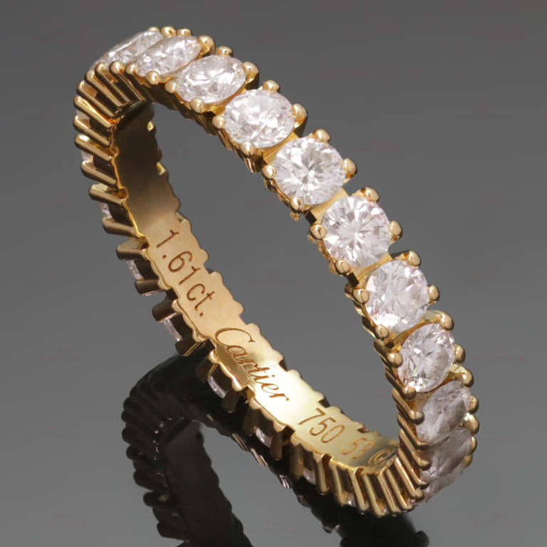This modern Cartier eternity ring is made in 18k yellow gold and set with round brilliant-cut E-F VVS2-VS1 diamonds of an estimated 1.61 carats. Romantic and timeless. Measurements: 0.11