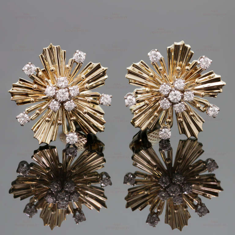 These magnificent Cartier earrings feature a retro starburst design made in 18k yellow gold and prong-set with round brilliant-cut F-G VVS2-VS1 diamonds of an estimated 1.35 carats. Circa 1940s. Measurements: 0.86