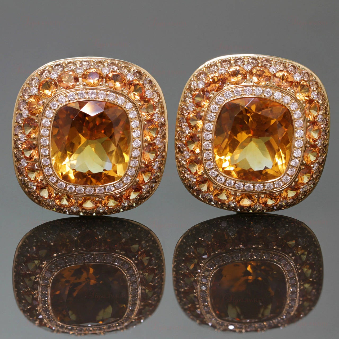 These captivating earrings are hand-made in 18k yellow gold and are set with 12.0mm x 14.0mm natural yellow citrines, accented with 100 sparkling white diamonds of an estimated 1.28 carat, 72 VS champagne diamonds of an estimated 2.16 carats, and