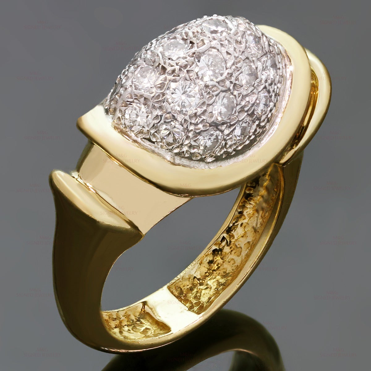 This classic womens ring is crafted in 18k yellow and white gold and set with brilliant-cut round G-H VS1-VS2 diamonds of an estimated 1.00 carats. Made in United States circa 1990s. Measurements: 0.47" (12mm) width. The ring size is 6.75 - EU