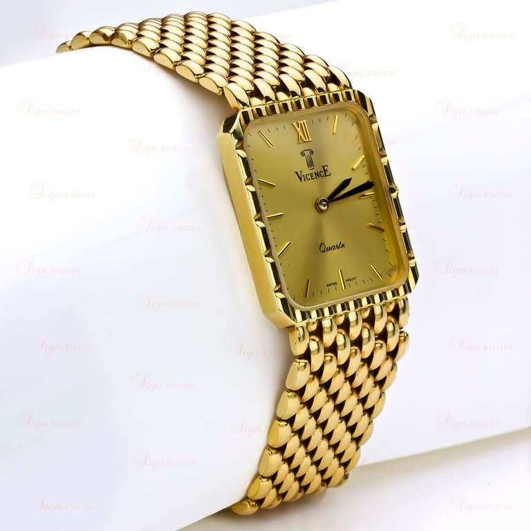 Vicence 14k yellow gold bracelet watch with a quartz movement, a champagne dial and gilt baton indexes. The bracelet features a fold-over clasp.  Measurements: 0.78