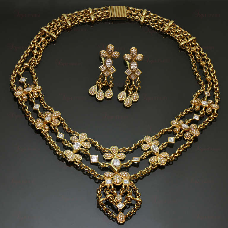 This fabulously stunning jewelry set features 352 diamonds of an estimated 9.50 carats. The evening necklace is composed of three rolo chains, pear-shaped elements pave-set with E-F VVS1-VVS2 diamonds and complemented with square and marquise-cut