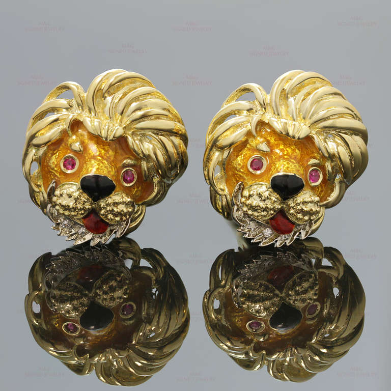 These vintage men's cufflinks feature charming lion heads made in textured 18k yellow gold and accented with enamel, sparlking G-H VS1-VS2 diamonds of an estimated 0.20 carats and faceted ruby eyes of an estimated 0.20 carats. Measurements: