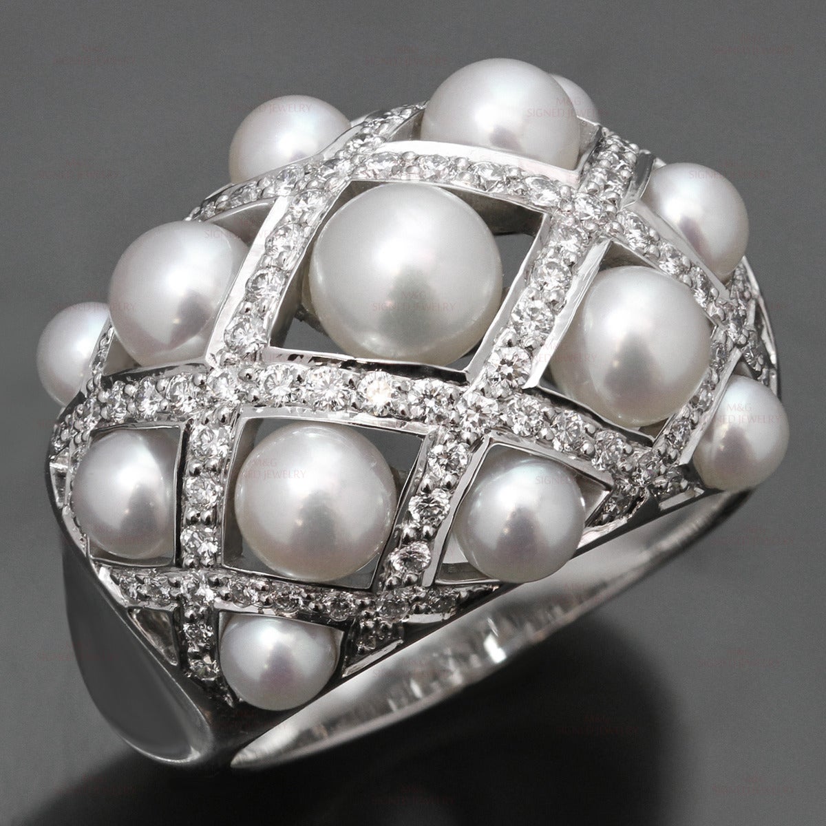 This magnificent domed Chanel ring from the Matelasse collection is crafted in 18k white gold and set with 13 cultured pearls measuring between 3.0mm to 6.0mm in diameter, accented with pave-set round brilliant-cut E-F VVS1-VVS2 diamonds of an
