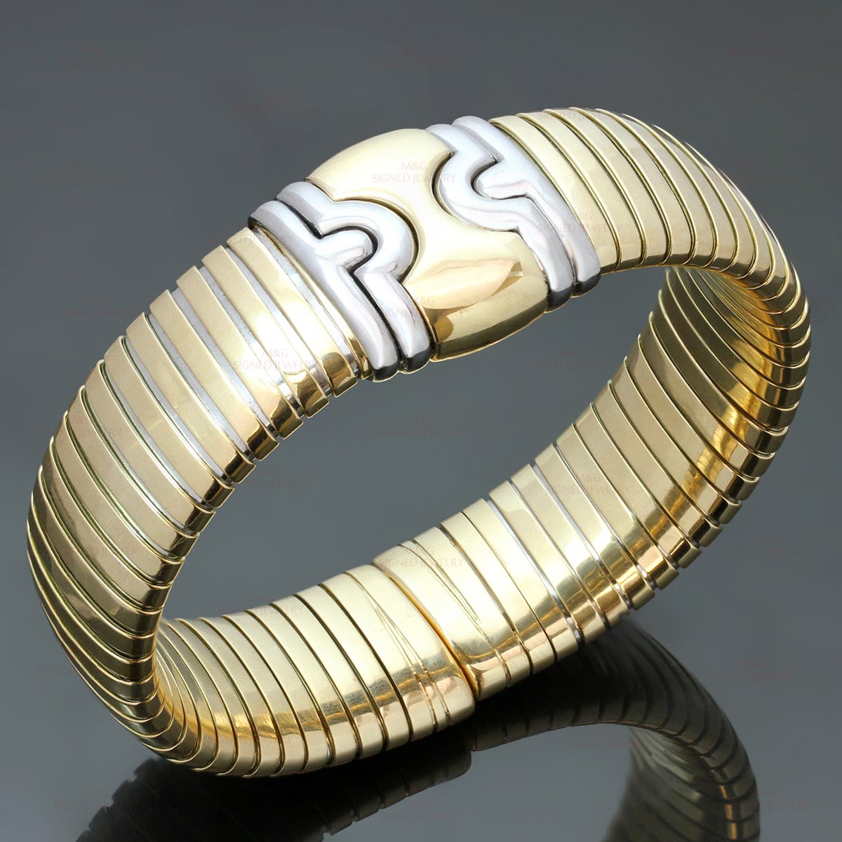 This elegant Bvlgari bracelet from the iconic Tubogas collection is crafted in 18k yellow gold and completed with 18k white gold accents. Made in Italy circa 1990s. Measurements: 0.70