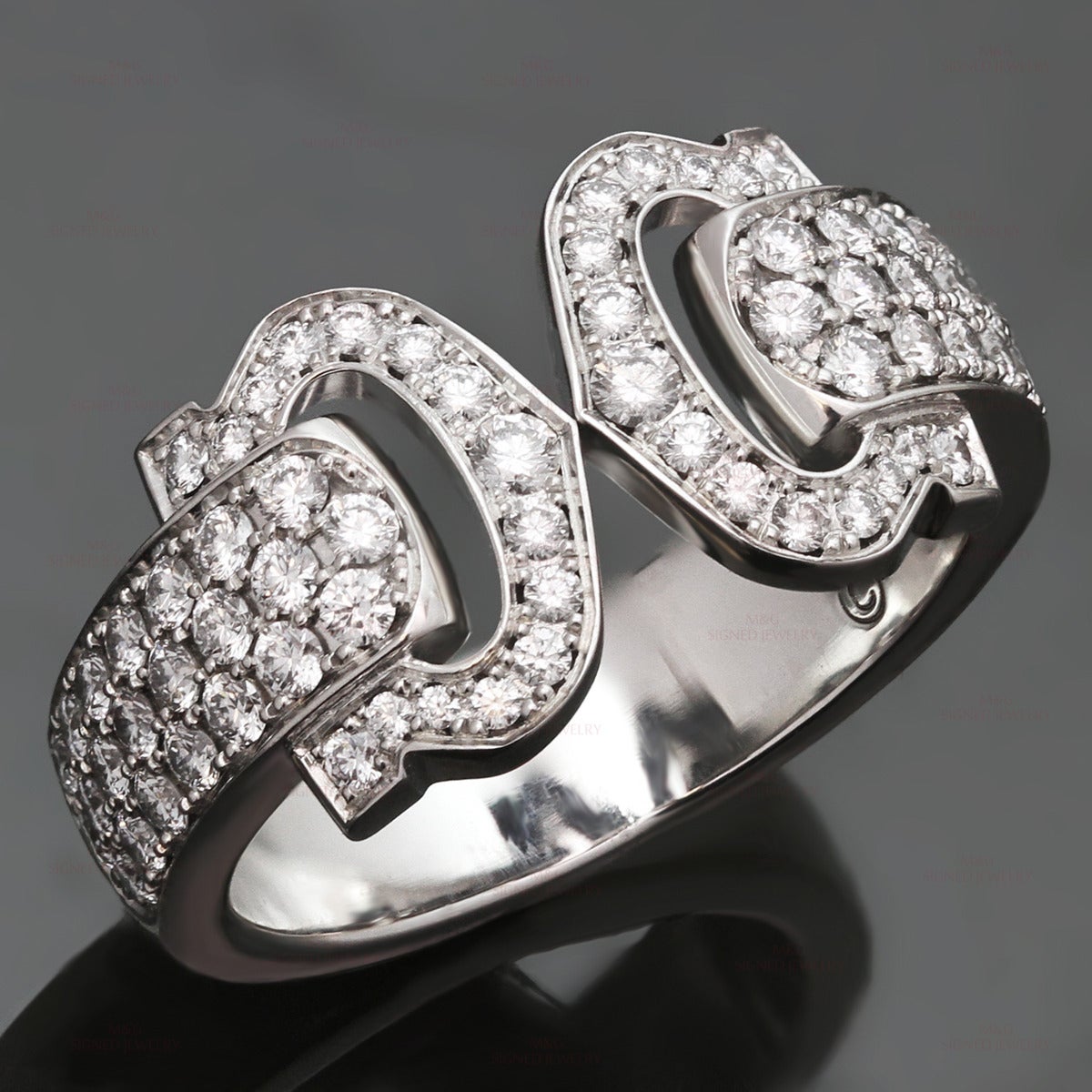 This fantastic Cartier ring from the Logo collection features the iconic Double C Decor design crafted in 18k white gold and set with round brilliant E-F VVS1-VVS2 diamonds of an estimated 1.20 carats. Made in France circa 2008. Measurements: 0.38