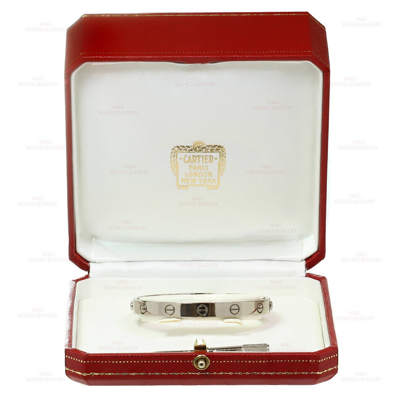 This iconic and timeless bracelet from Cartier's Love collection is finely crafted in 18k white gold and completed with the original Cartier screwdriver and box. This bangle is the size 16 model. Made in France circa 1993. . The estimated retail