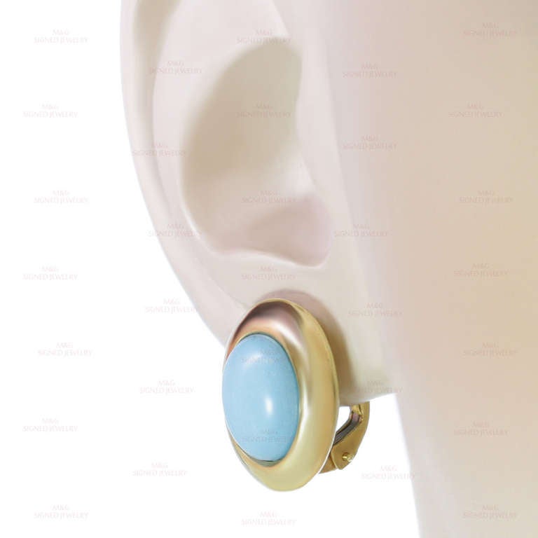 These modern lever-back earrings feature 8.0mm x 10.0mm oval turquoise stones set in 18k yellow gold. A classic design. Measurements: 0.47