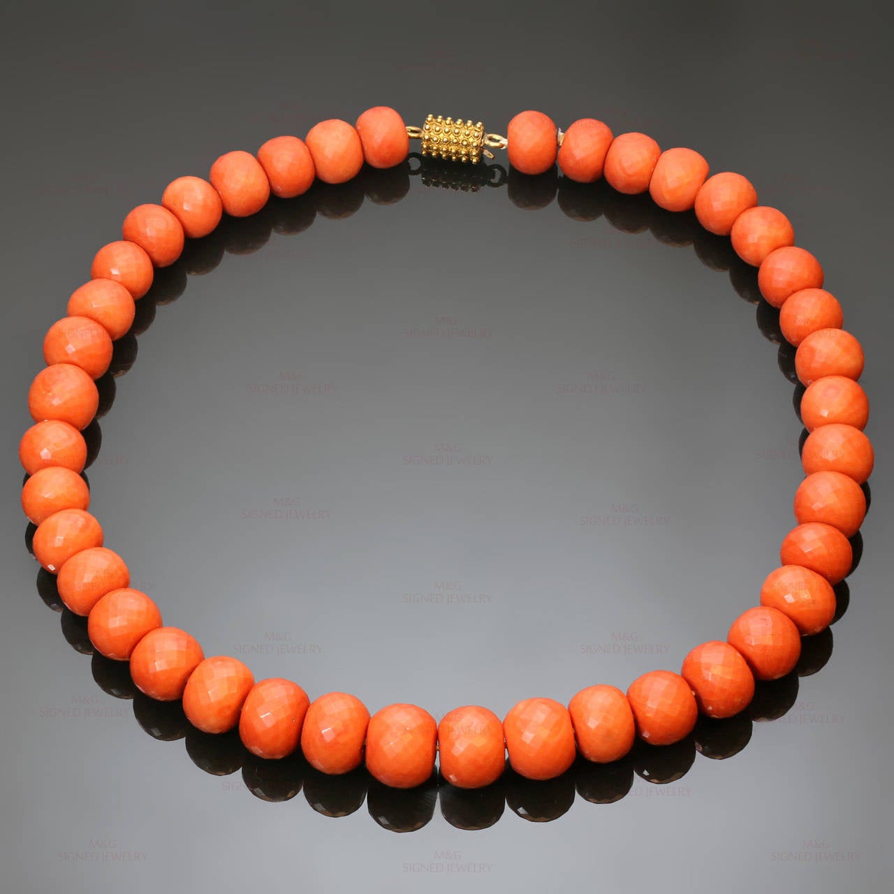 This fabulous 1940s necklace features red coral beads and a yellow gold clasp. The clasp is not stamped, but tested positive for 14k gold. These semi-translucent faceted beads are of Mediterranean origin and catch light beautifully. The beads