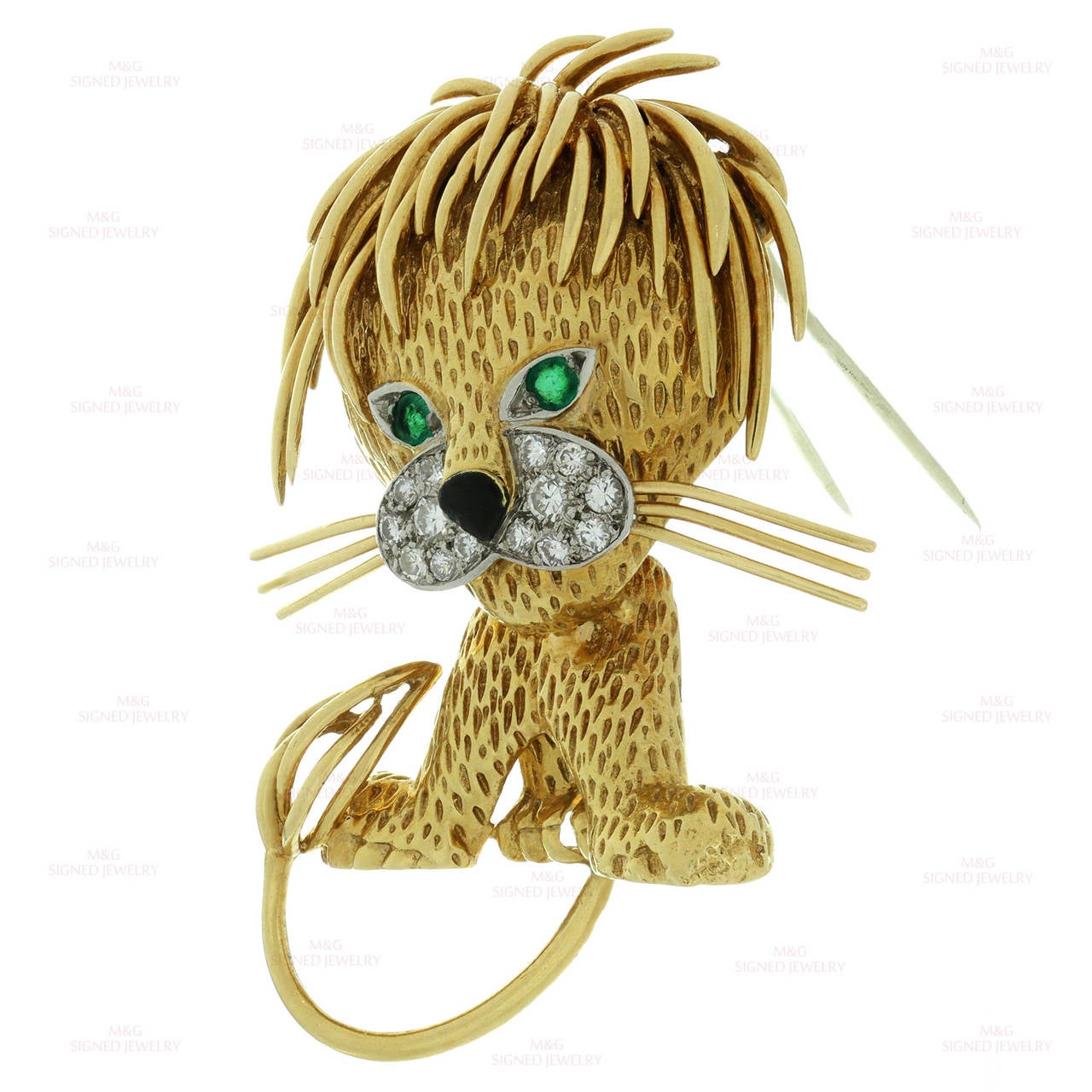 Be fearless with this iconic lion brooch from Van Cleef & Arpels. Beautifully made in 18k yellow gold and accented with an estimated 0.52 carats of F-G VS1-VS2 diamonds and green emerald eyes. With French assay mark. Circa 1962.