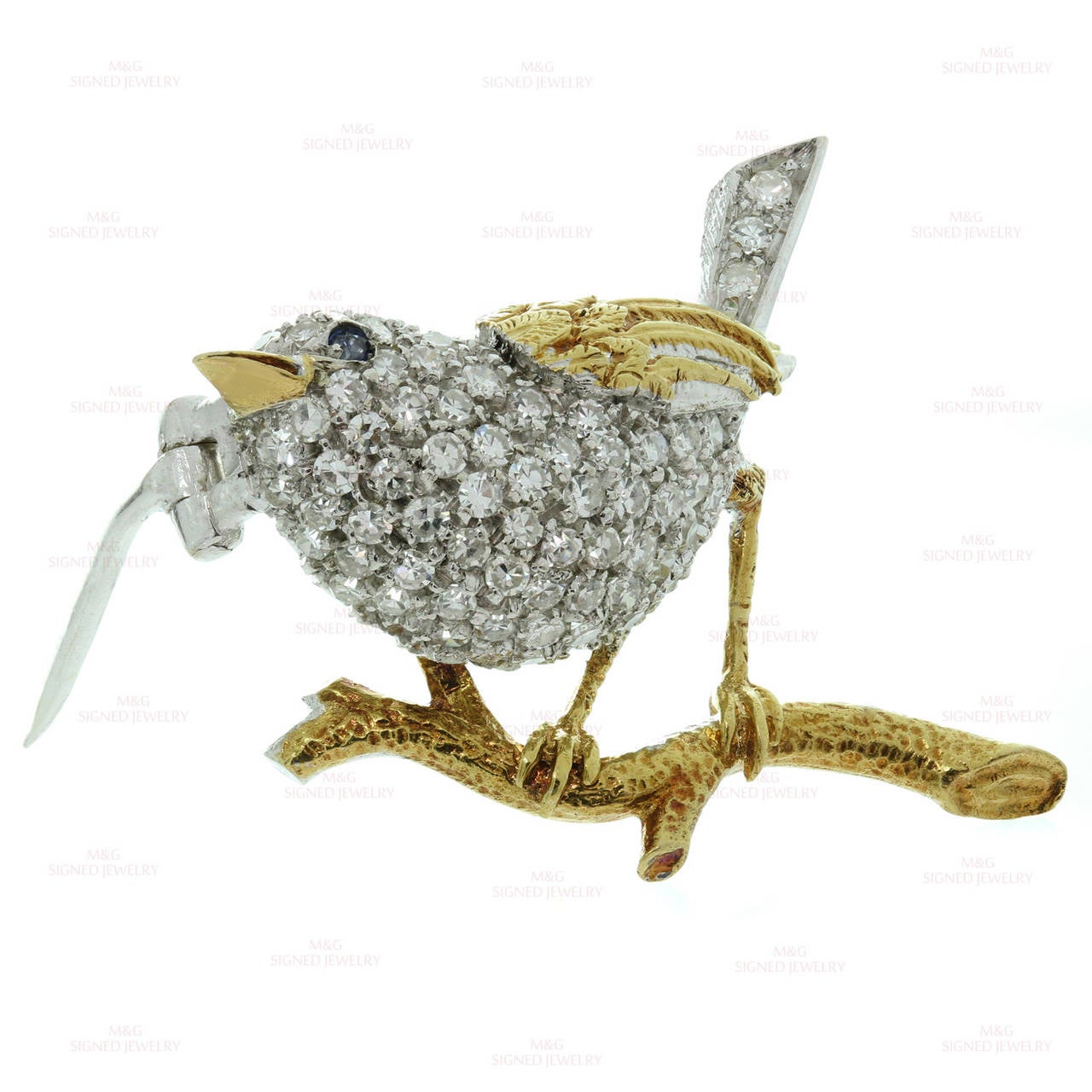 This elegant Tiffany & Co. brooch is crafted out of 18k yellow gold in the shape of a charming bird and accented with sparkling round diamonds of an estimated 0.95 carats and a blue sapphire eye. Made in Italy for Tiffany & Co  circa 1960s.