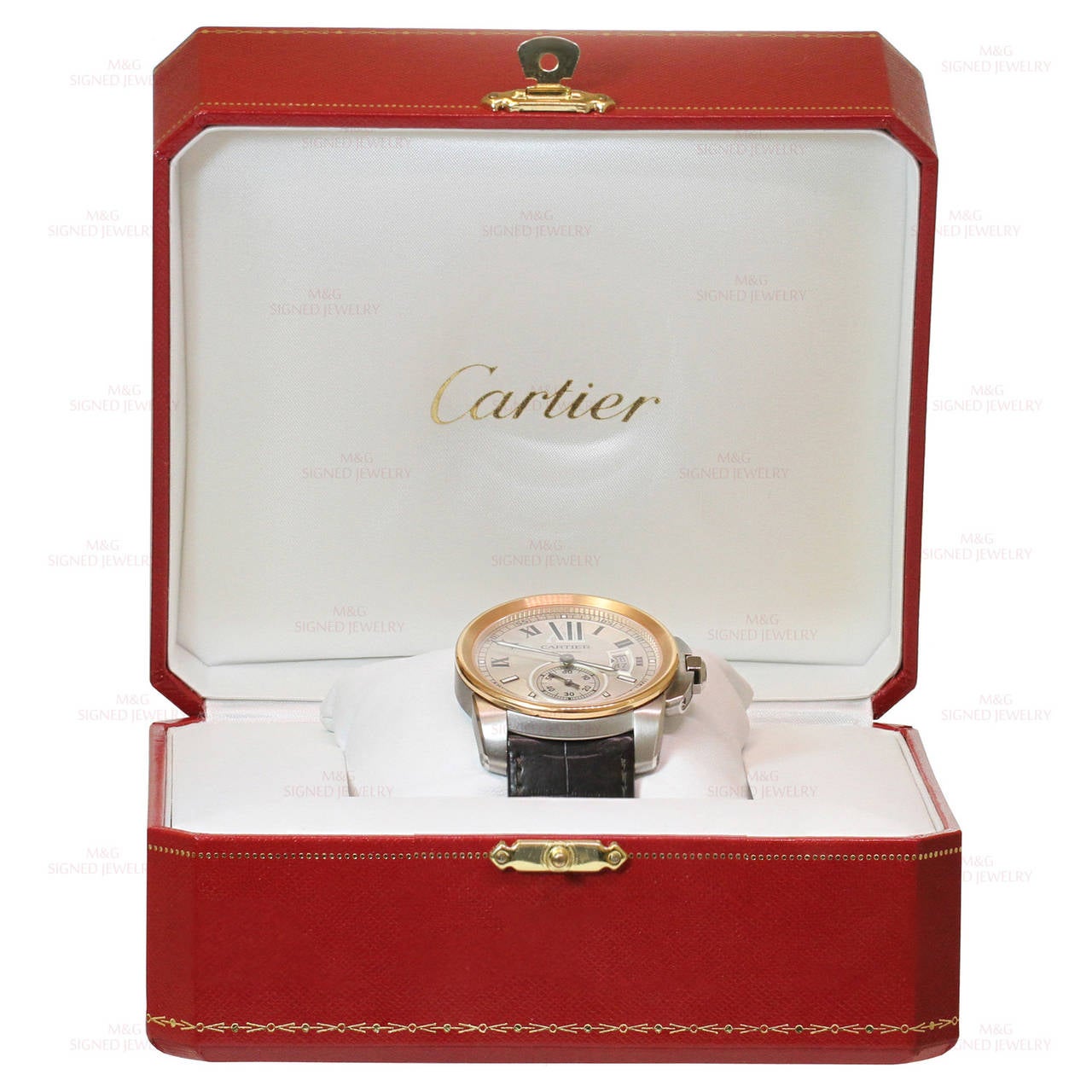 This classic all-original Cartier men's watch features automatic self-winding movement, round stainless steel case measuring 42.0 mm in diameter, a crown cover with faceted blue spinel, an exhibition case back, a high-polish 18k rose gold fixed