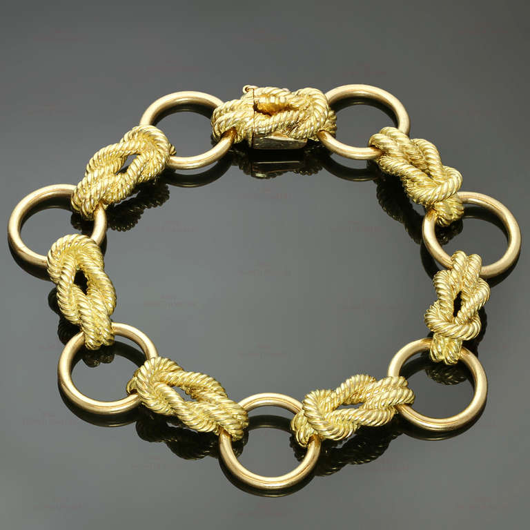 This classic Hermes bracelet is made in 18k yellow gold and designed as a series of polished circular links spaced by gold rope work links. Signed Hermes Paris, numbered, with French assay marks. Measurements: 0.55