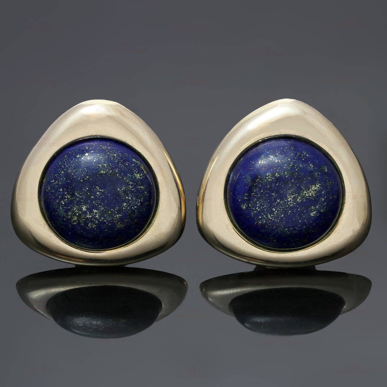 These chic vintage triangular lever-back earrings are crafted in 14k yellow gold and elegantly accented with round 18.0mm lapis lazuli stones. Made in United States circa 1980s. Measurements: 1.06" (27mm) width.