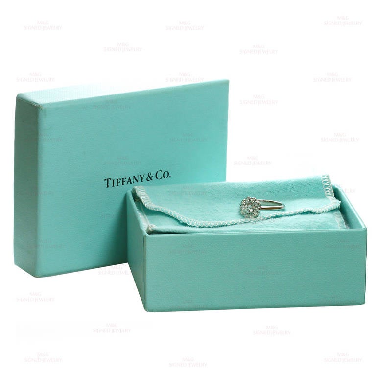 This modern flower ring from the classic Rose collection by Tiffany & Co. is made in fine platinum and set with round brilliant-cut E-F VVS2-VS1 diamonds of an estimated 0.35 carats. Simply stunning. Measurements: 0.35