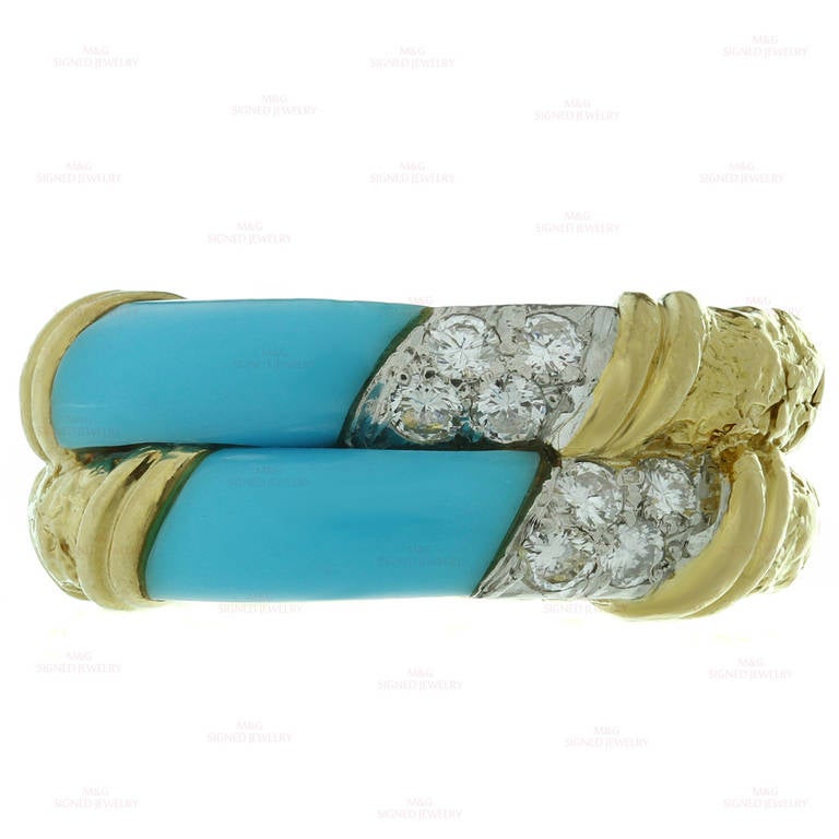 This classic Van Cleef & Arpels ring features a beautifully textured 18k yellow gold double band design encrusted with vivid blue turquoise and an estimated 0.20 carats of brilliant-cut E-F VVS1-VVS2 diamonds set fine platinum. An iconic 1960s