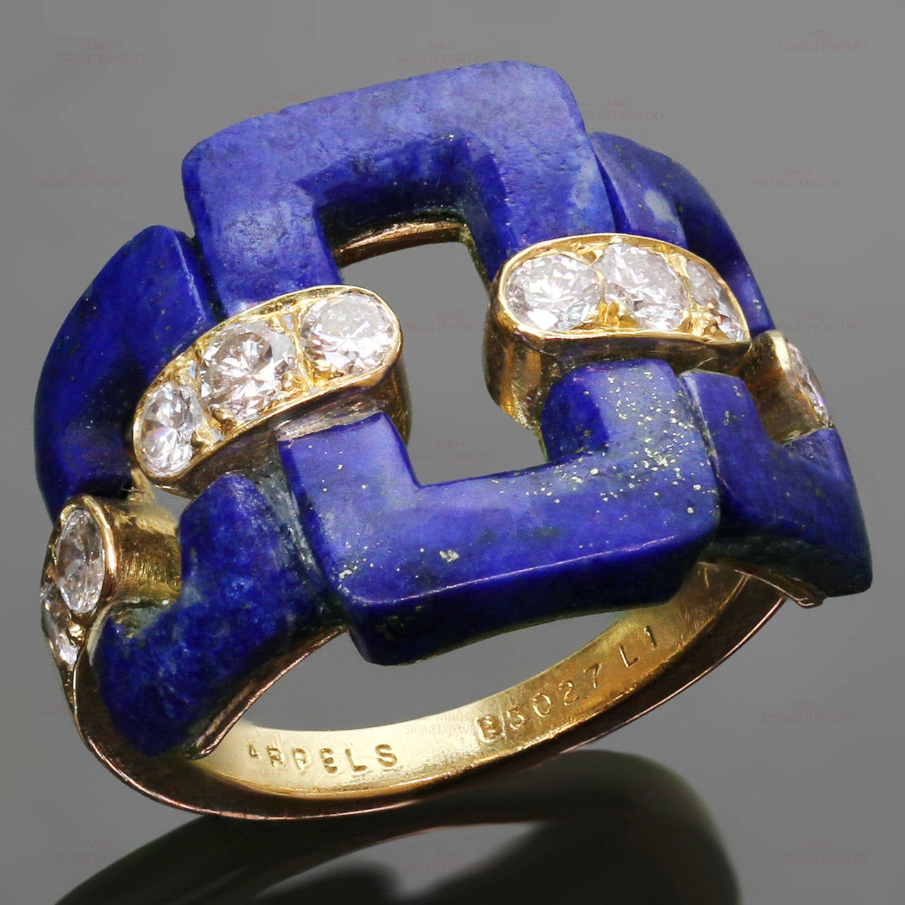 This fabulous Van Cleef & Arpels ring is crafted in 18k yellow gold and beautifully adorned with lapis lazuli stones and brilliant-cut round diamonds of an estimated 0.50 carats. Made in France circa 1960s. Measurements: 0.59