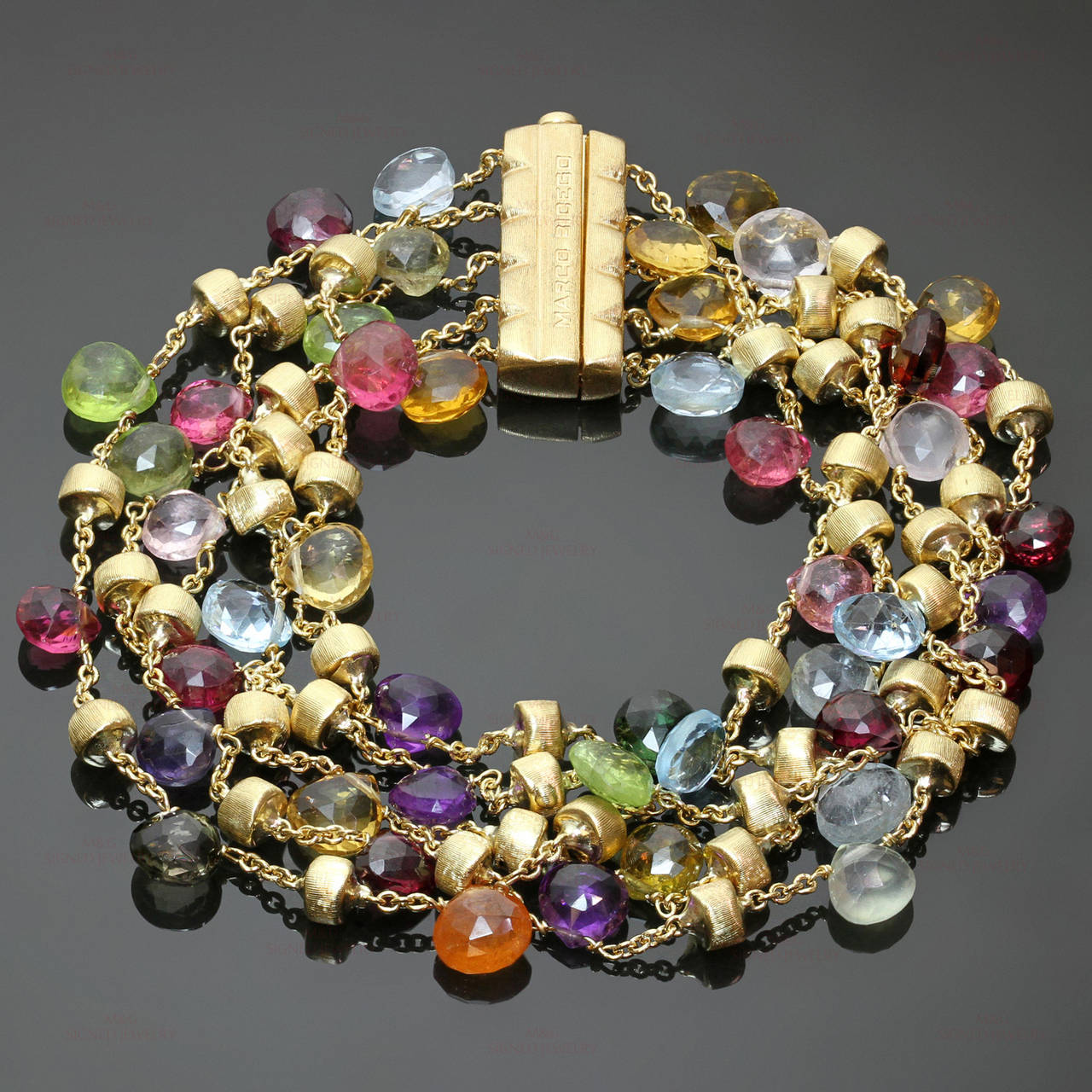 This stunning Marco Bicego bracelet from the playful Paradise collection features a 5-strand design of faceted semi-precious gemstones, accented with hand-engraved 18k gold beads. Each piece in this collection has a unique array of gemstones and may