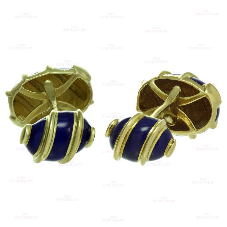 These modern Tiffany & Co. cufflinks were designed by Schlumberger and feature an olive-shaped ridged design made in 18k yellow gold and accented with blue enamel. Classic and handsome elegance. Measurements: 0.43