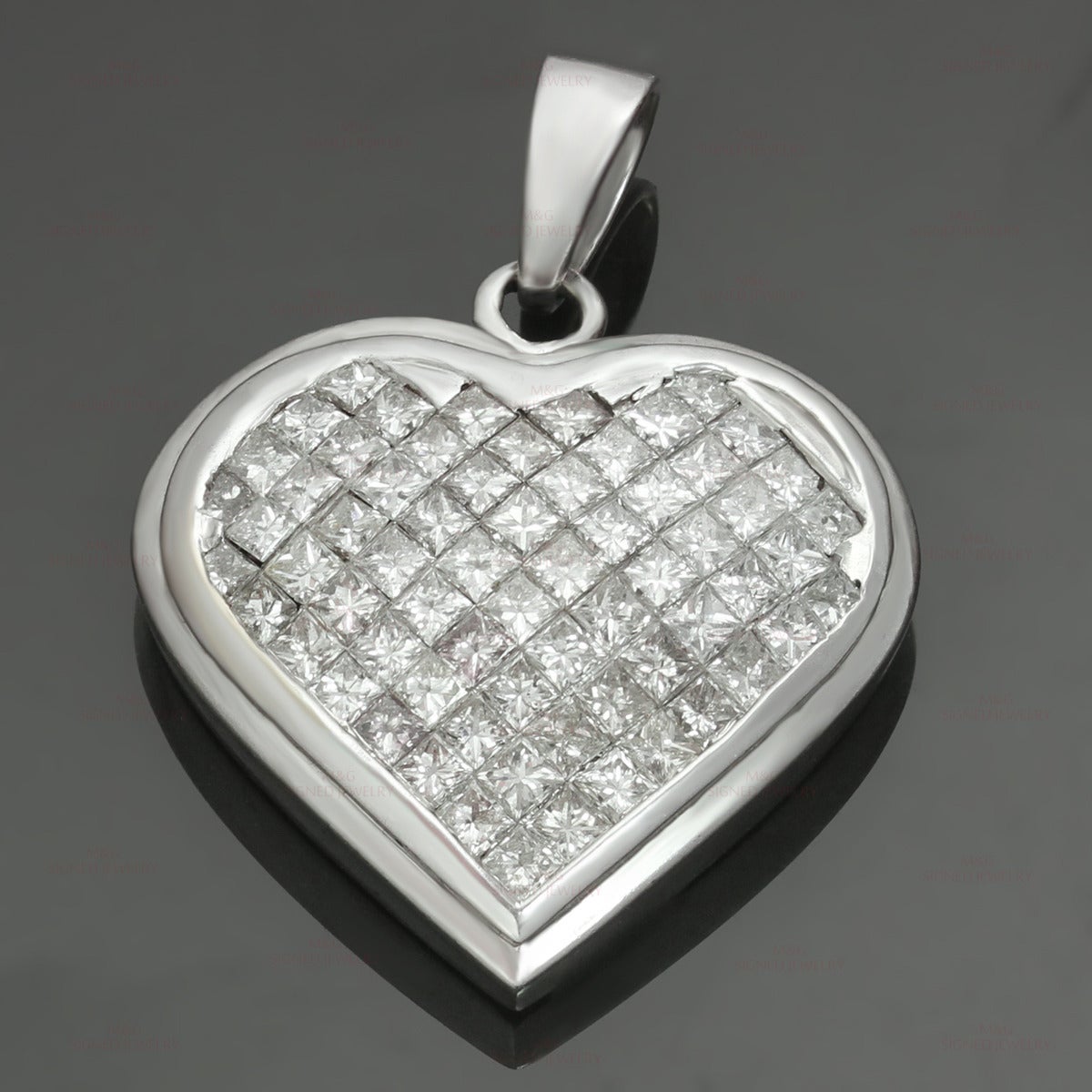 This fabulous heart-shaped pendant is made in 18k white gold and features a stunning invisible setting of princess-cut G-H VS1-VS2 diamonds of an estimated 3.25 carats. Chic and romantic. Measurements: 0.82" (21mm) width, 1.10" (28mm)