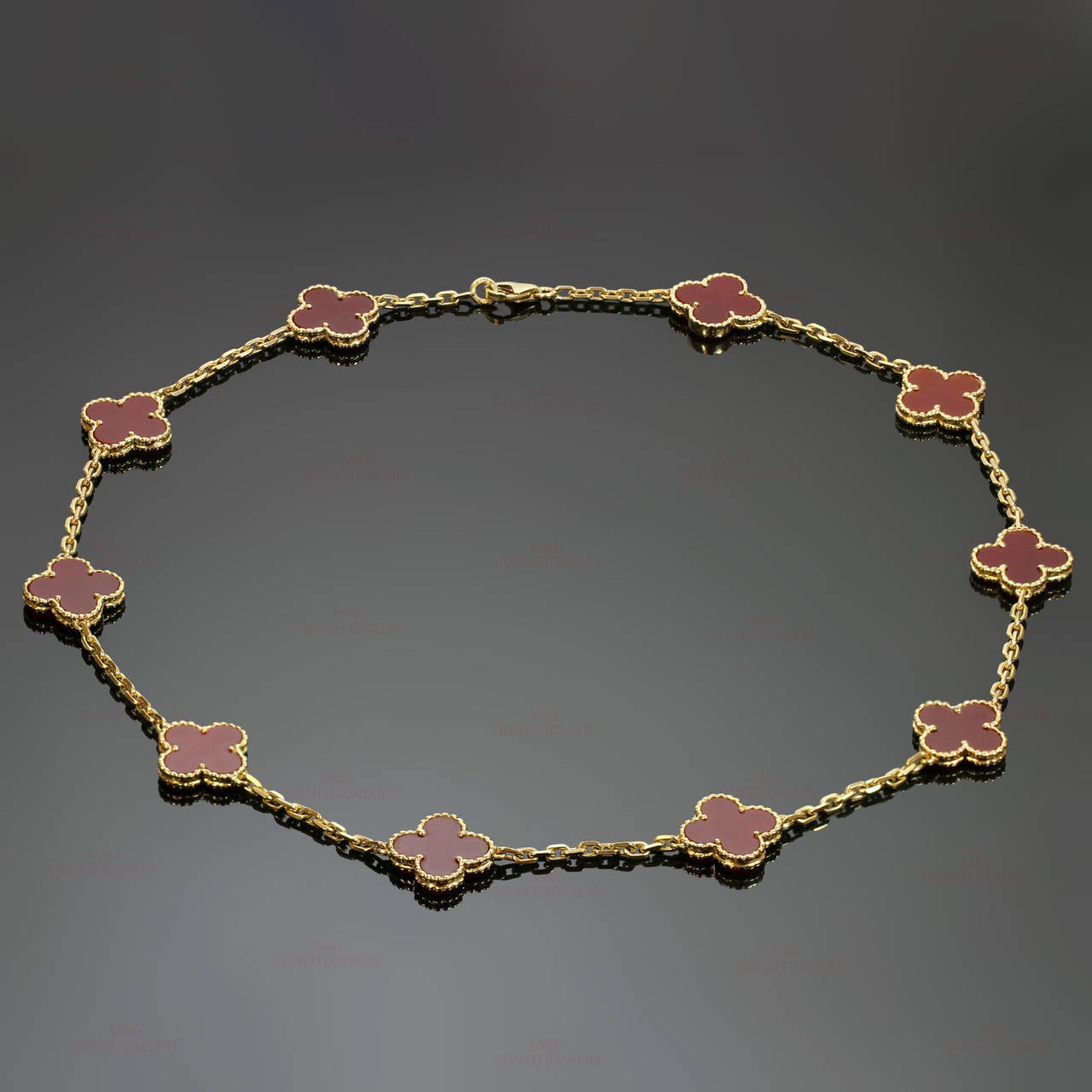This classic Van Cleef & Arpels necklace is crafted in 18k yellow gold and features 10 icons of luck from the Vintage Alhambra collection made of red carnelian in round bead settings. Simply stunning. Measurements: 0.55