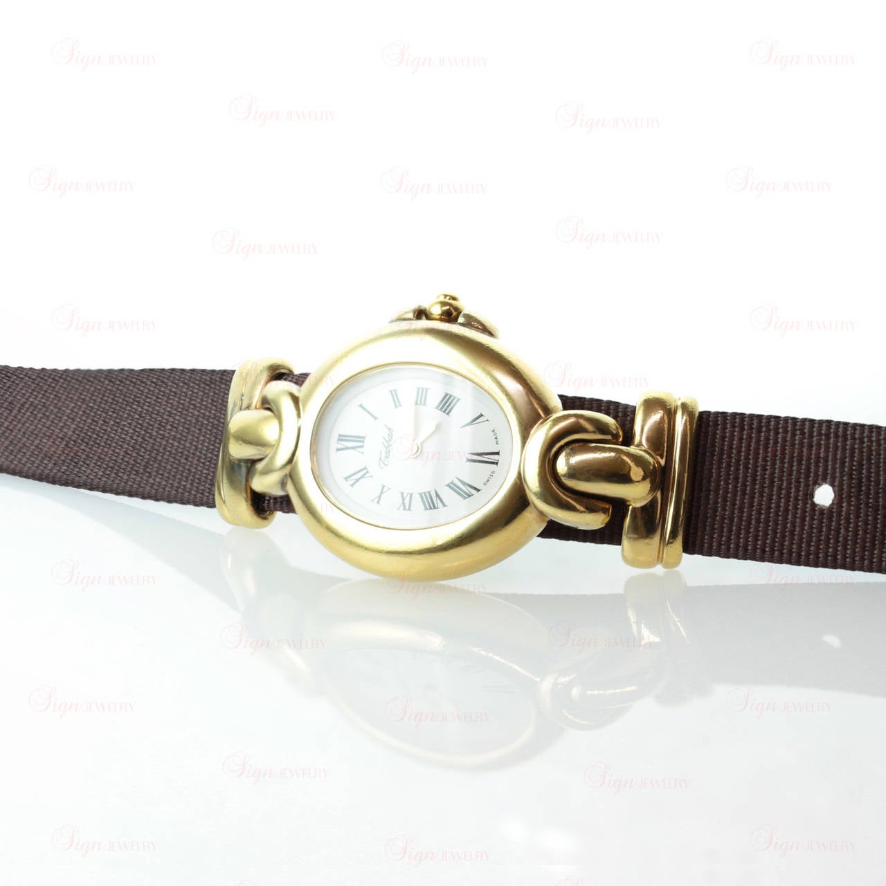 This elegant lady's Tabbah's Copacabana wristwatch is made in gold-plated silver and features a quartz movement, a white dial, gold-plated hands, black roman numerals and a textured brown satin strap. 

Measurements: 1.06" (27mm) width,