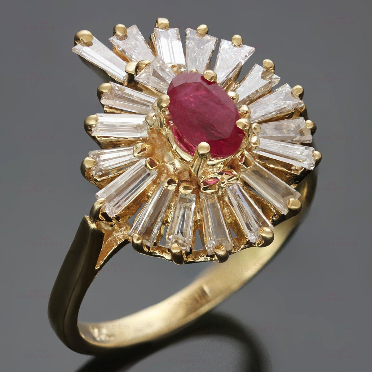 This classic vintage cocktail ring is made in 14k yellow gold and features a swirling design set with baguette-cut H-I VS2-SI1 diamonds of an estimated 1.55 carats and an oval red ruby of an estimated 0.40 carats. Measurements: 0.70" (18mm)