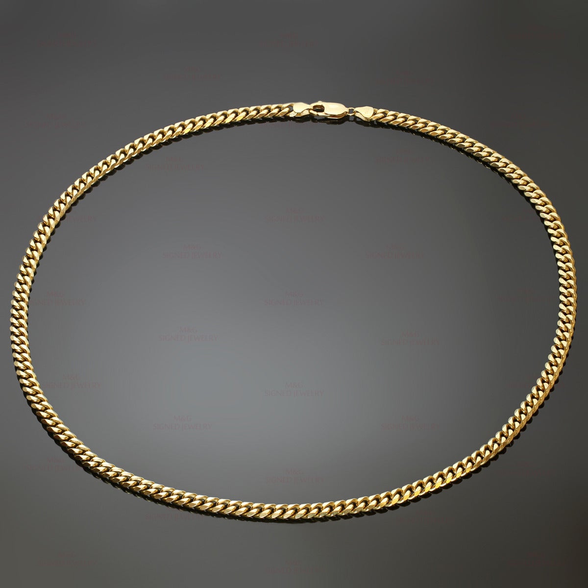 This classic necklace features a curb link chain crafted in 18k yellow gold. Made in Italy circa 1990s. Measurements: 0.19