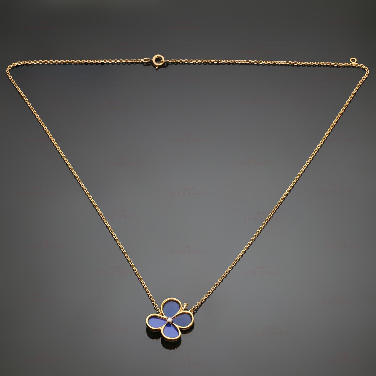 A stunning Van Cleef & Arpels clover necklace from the classic Vintage Alhambra collection. Made in 18k yellow gold and featuring Lapis Lazuli petals and a sparkling solitaire brilliant-cut diamond of an estimated 0.03 carats. France circa 1973.