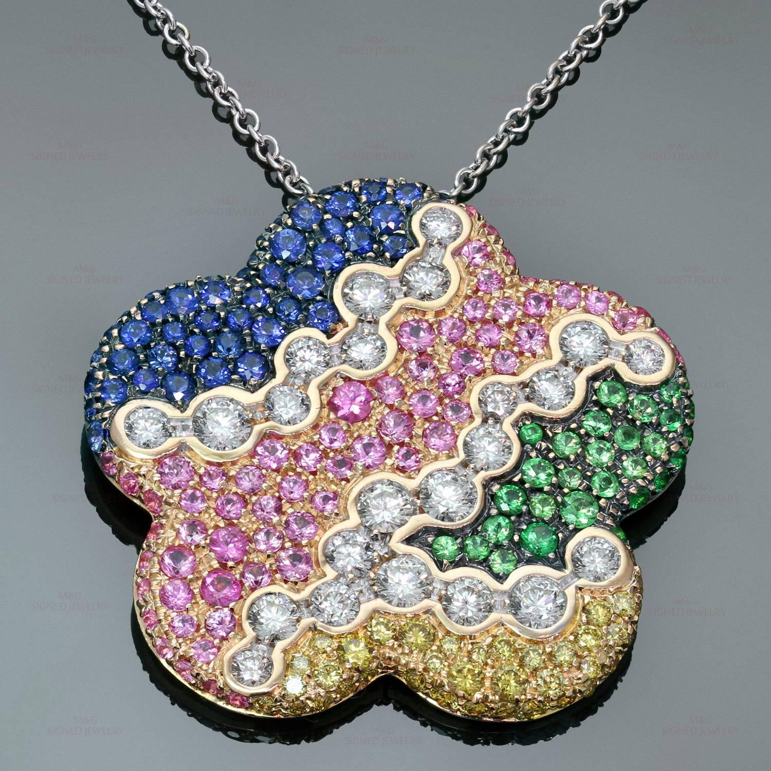 This stunning pendant necklace by Luca Cara features a colorful floral design crafted in 18k rose, white & yellow gold and ornately set with 38 yellow diamonds (about 0.90 carats), 23 white diamonds (about 1.75 carats), 69 pink sapphires, 51 blue