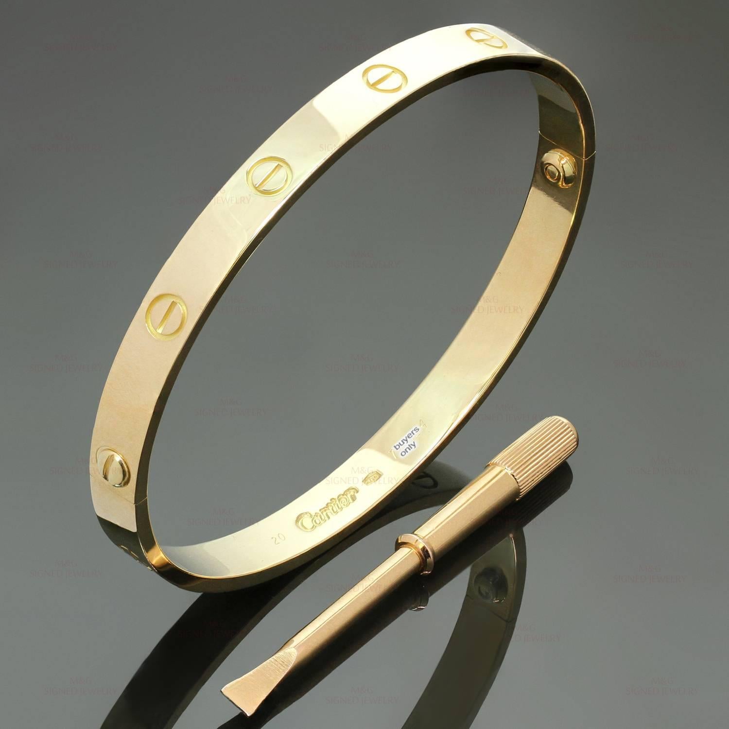 This iconic and timeless bracelet from Cartier's Love collection is finely crafted in 18k yellow gold and completed with the original Cartier screwdriver. This bangle is a size 20. Made in France circa 2000s. Measurements: 0.23