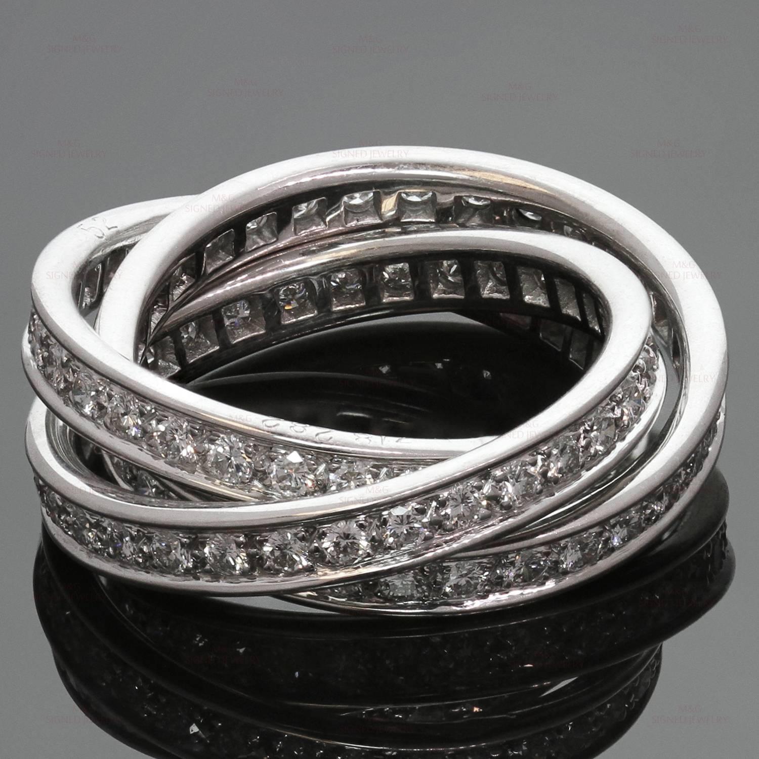 This iconic ring from Trinity de Cartier collection features 3 interconnected bands in crafted 18k white gold and beautifully pave-set with brilliant-cut diamonds of an estimated 1.55 carats. A classic and elegant design made in France circa 2000s.