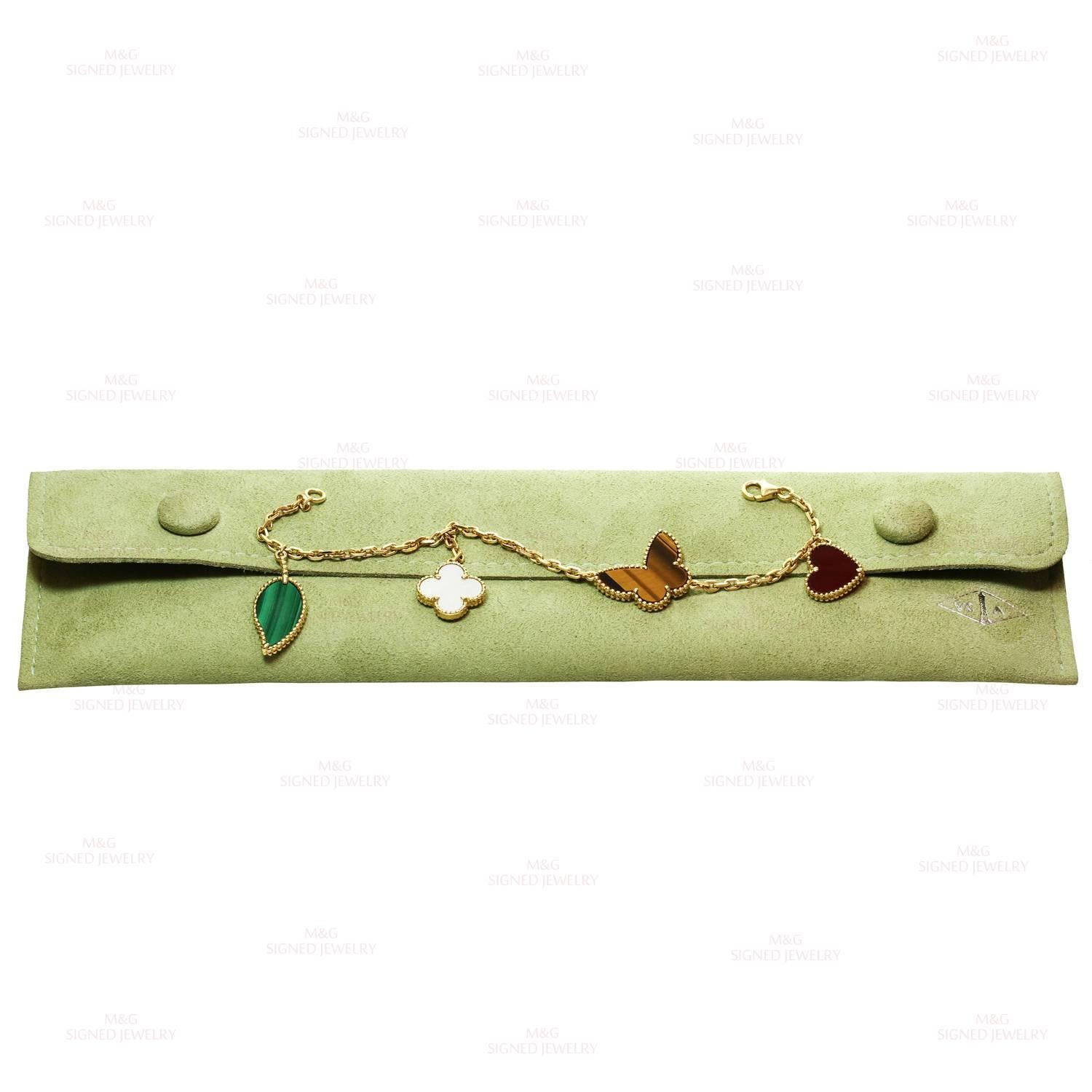 This fabulous bracelet from the iconic Alhambra collection by Van Cleef & Arpels is crafted in 18k yellow gold and features 4 charms - a carnelian heart, a tiger's eye butterfly, a green malachite leaf and a mother-of-pearl lucky clover. France