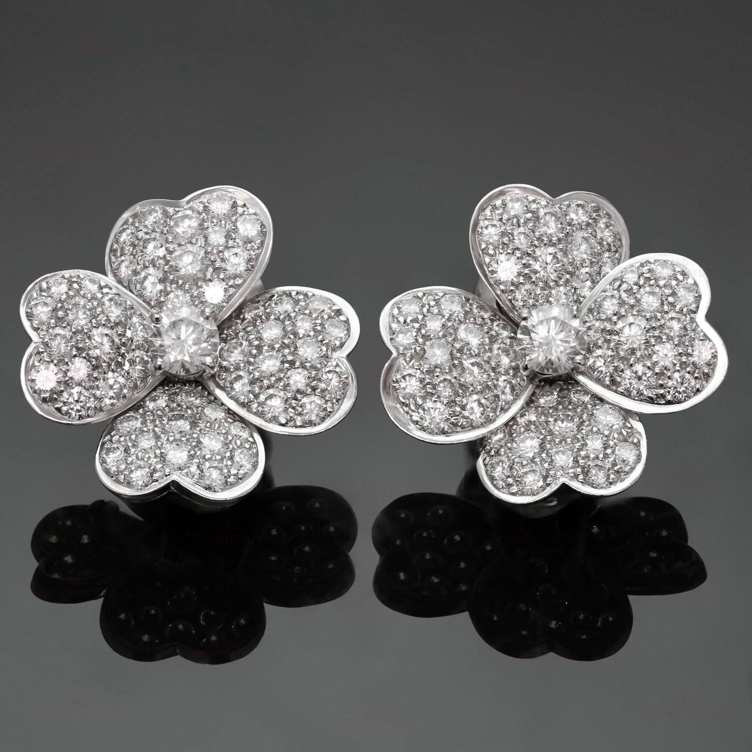 These exquisite medium model clip-on earrings from the Cosmos collection by Van Cleef & Arpels feature a delicate flower design crafted in 18k white gold and set with 106 brilliant-cut D-F quality & IF to VVS color diamonds of an estimated 3.15