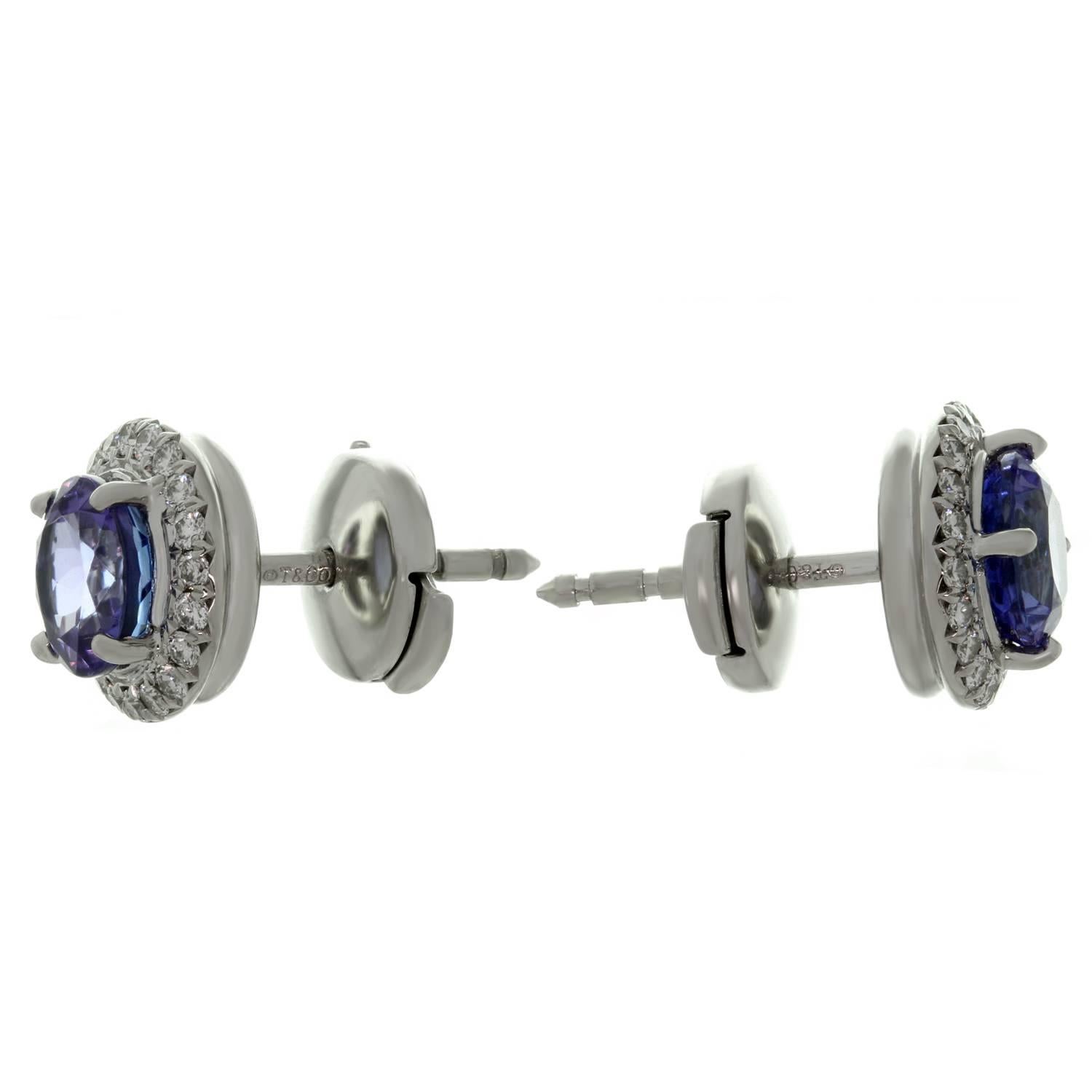 These exquisite stud earrings from Tiffany's Seleste collection are crafted in platinum and set dazzling tanzanites of an estimated 1.40 carats surrounded by brilliant-cut round diamonds of an estimated 0.20 carats. Made in United States circa