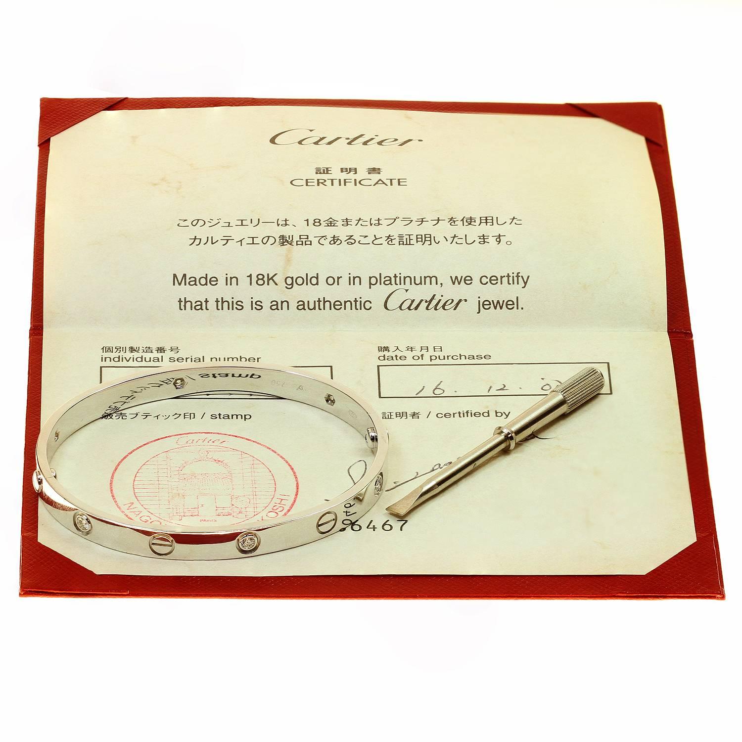 This iconic and timeless bracelet from Cartier's Love collection is finely crafted in 18k white gold and set with 6 brilliant-cut round diamonds. This bangle is a size 18. Completed with the original Cartier screwdriver, box, papers. Made in France