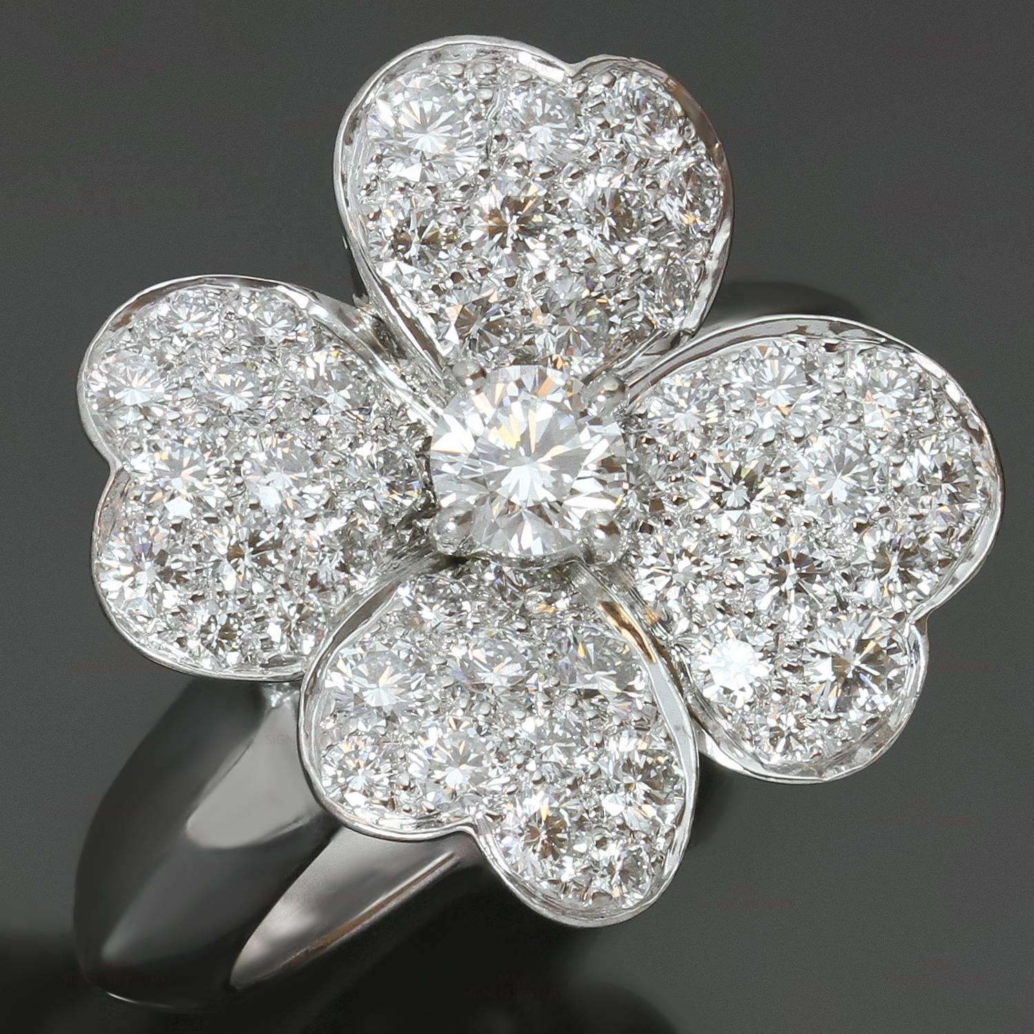 This fabulous hand-made Van Cleef & Arpels ring from the elegant Cosmos collection features a 4-petal flower motif crafted in 18k white gold and set with brilliant-cut round diamonds of an estimated 1.70 carats. This is the medium model of the ring