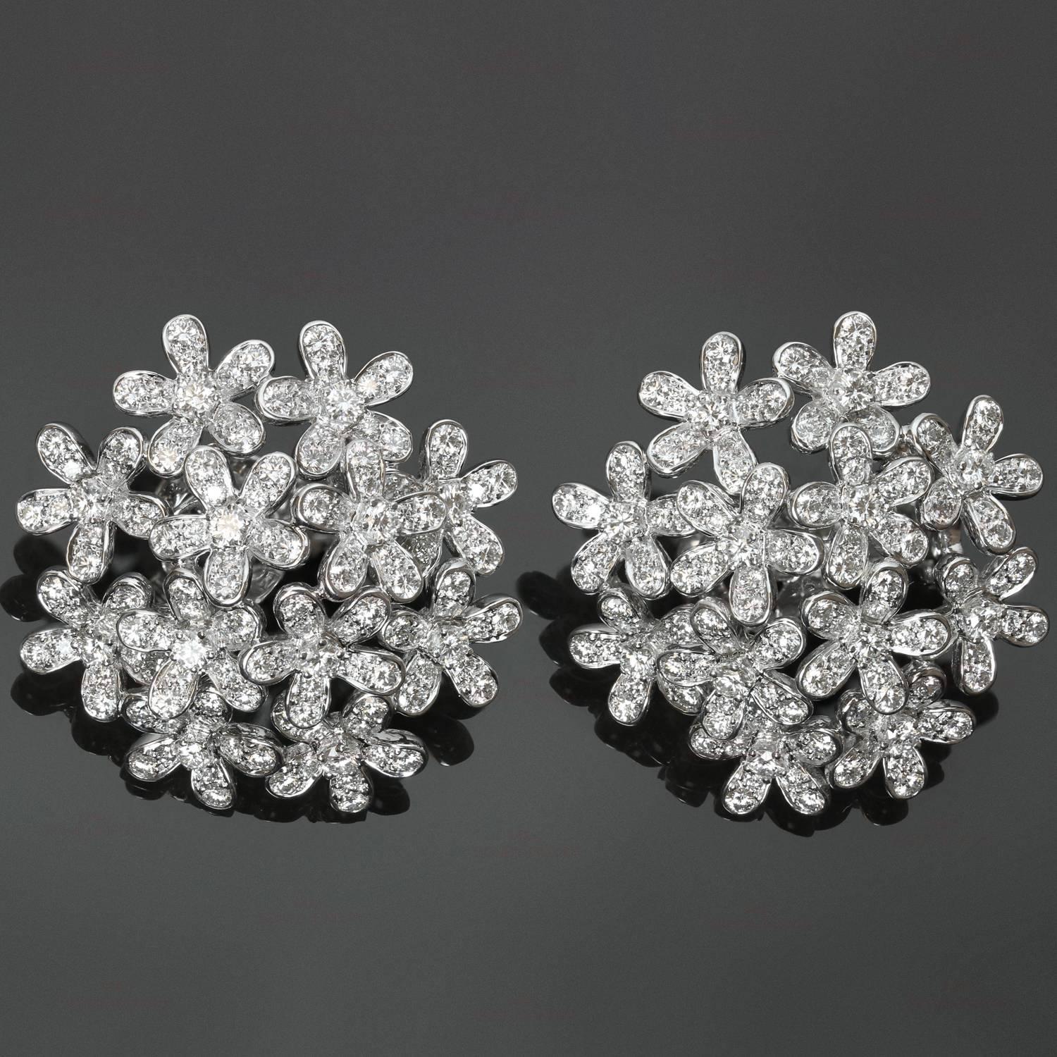 These stunning hand-made Van Cleef & Arpels earrings from the exquisite Socrate collection feature a delicate floral motif crafted in 18k white gold and set with approximately 265 brilliant-cut round diamonds of an estimated 5.45 carats. These