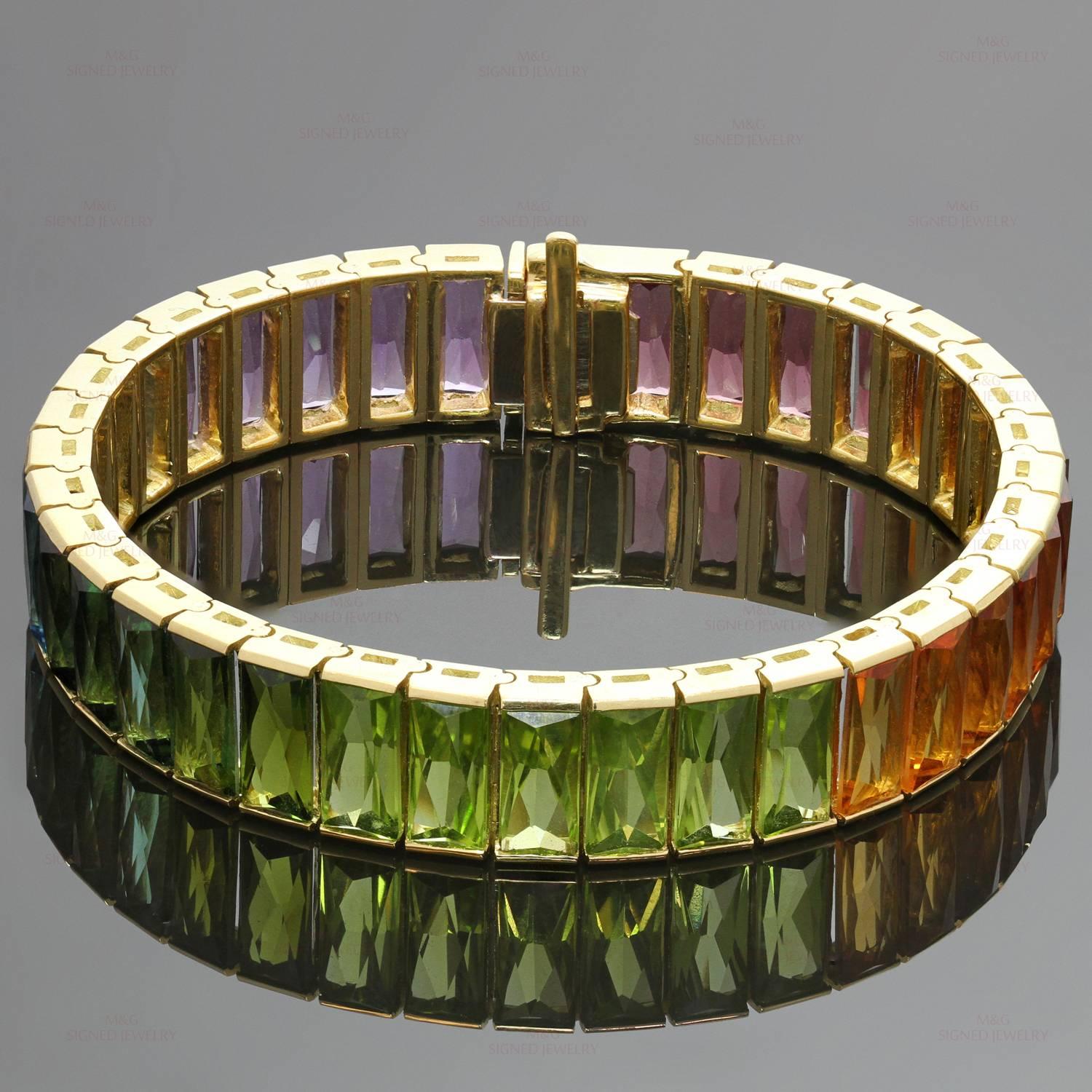 The fabulous H. Stern bracelet is crafted in 18k yellow gold and set with a rainbow gradient of faceted rectangular-cut gemstones of an estimated 41.65 carats - amethyst (about 5.15 carats), blue topaz (about 6.75  carats), tourmaline (about 6.35