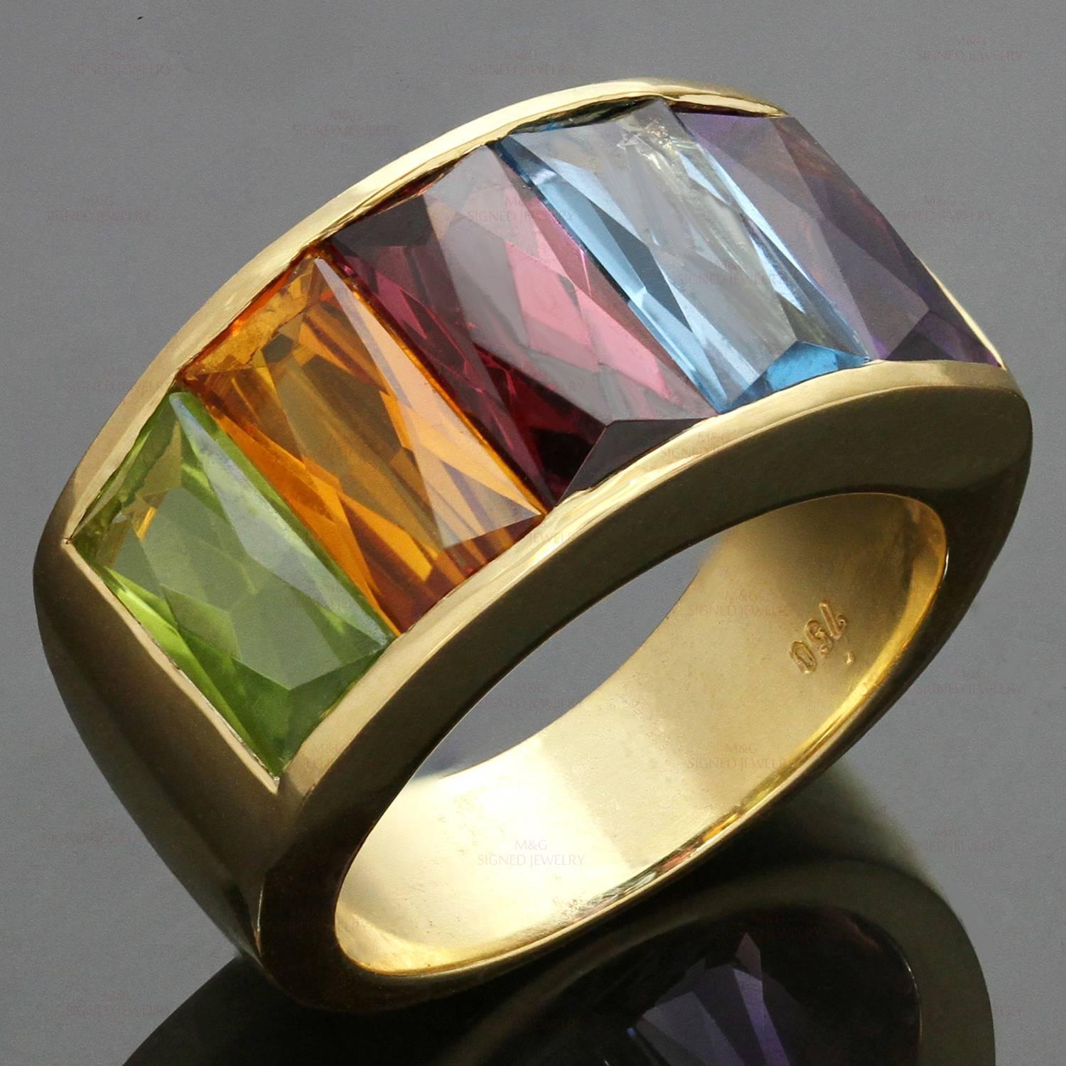 This fabulous H. Stern ring crafted in 18k yellow gold and set with a colorful gradient of faceted rectangular-cut gemstones of an estimated 7.50 carats - amethyst, blue topaz, peridot, citrine, and garnet. Seven stones are abraded. No makers mark,