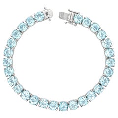 Sterling Silver 28ctw Light Blue Topaz Line Tennis Bracelet w/ Push Clasp