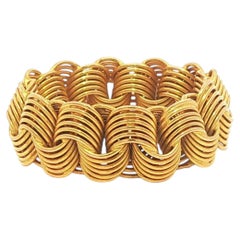 Bague en or jaune 18k, 7.8mm de large, avec des fils métalliques entrelacés