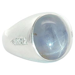 White Gold Oval Cabochon Star Sapphire w/ Diamond Arow Design Sides Bezel Ring