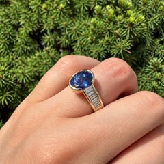 14k Yellow Gold 3.3ctw Oval Half Bezel Tanzanite w/ Baguette Diamond Sides Ring