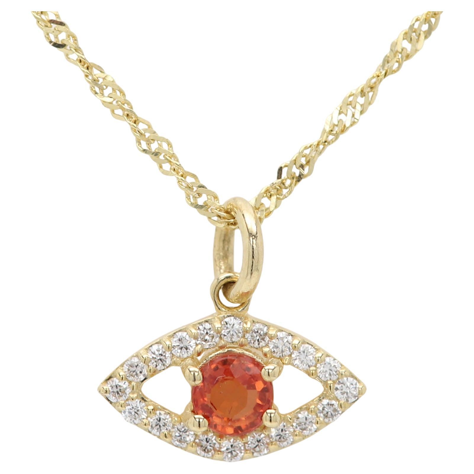 Mini œil maléfique en or jaune 14 carats avec saphir orange naturel au centre en vente