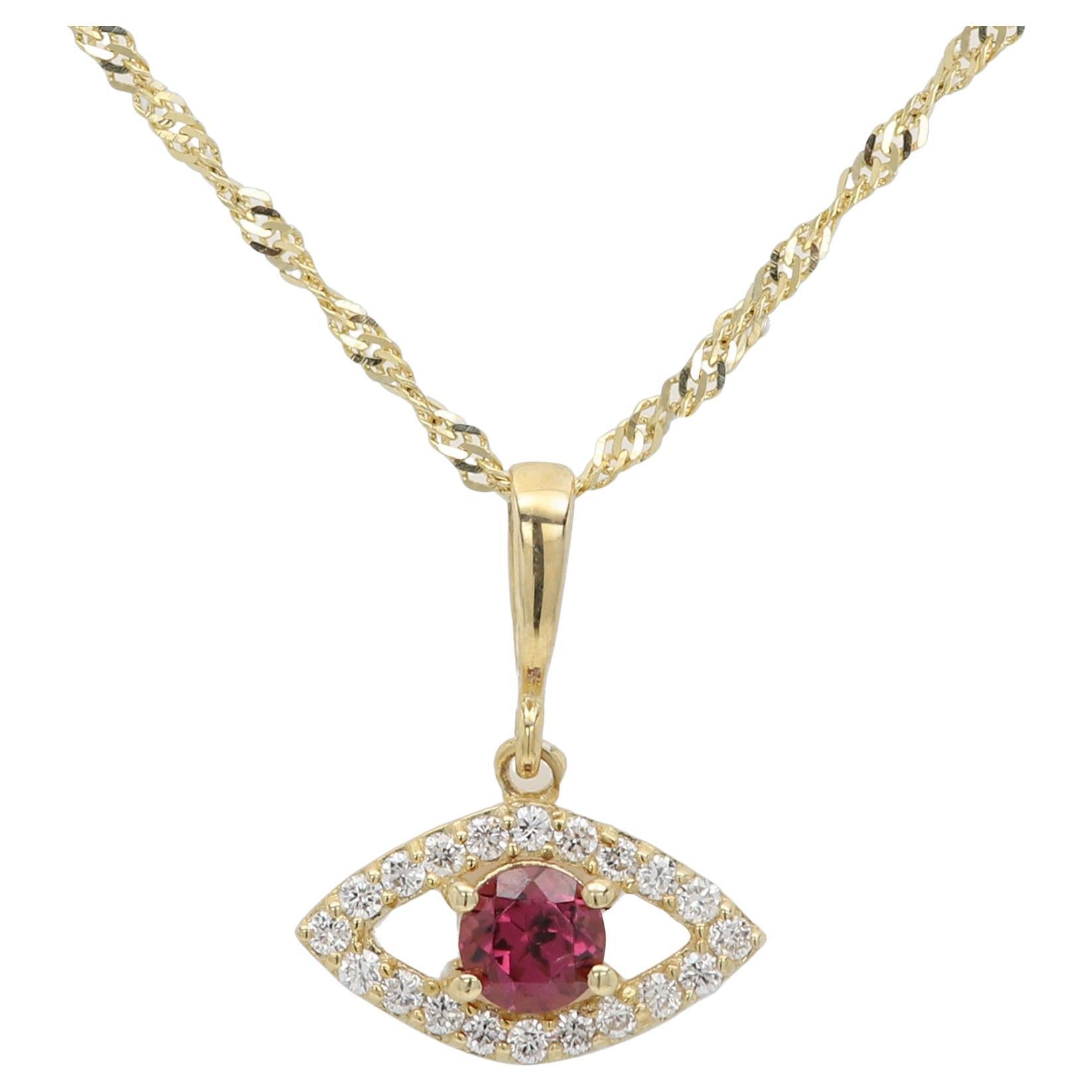 Mini œil maléfique en or jaune 14 carats avec rhodolite naturelle au centre