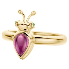 Anello moderno in oro giallo 18 carati con granato di rodolite