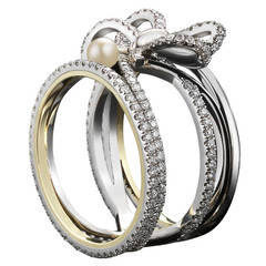 Contemporary Pearl Diamond Gold Platinum Bow Ring
